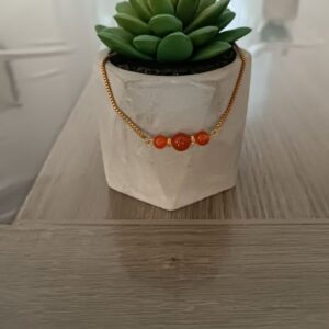 Bracelet Couleur or en acier , rouge